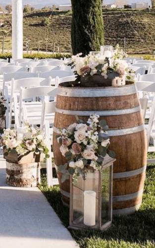 wine barrels wedding decor with flowers